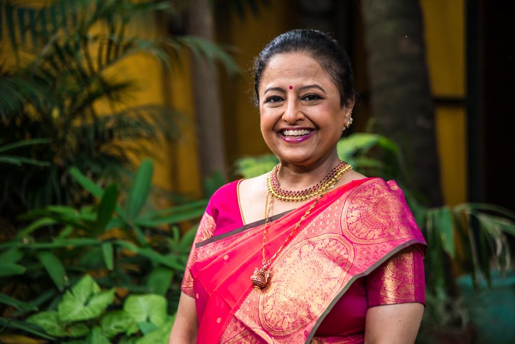 Sheila standing in front of plants